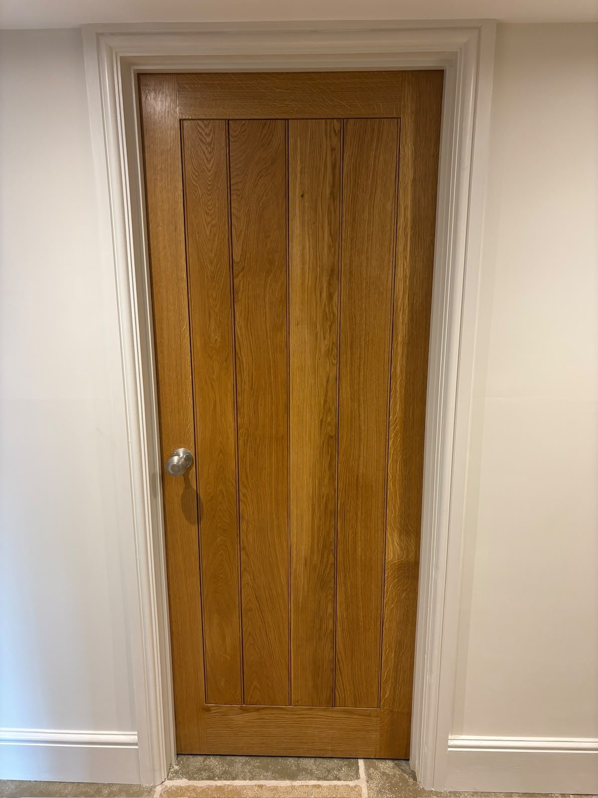Solid oak internal door with flagstone floor