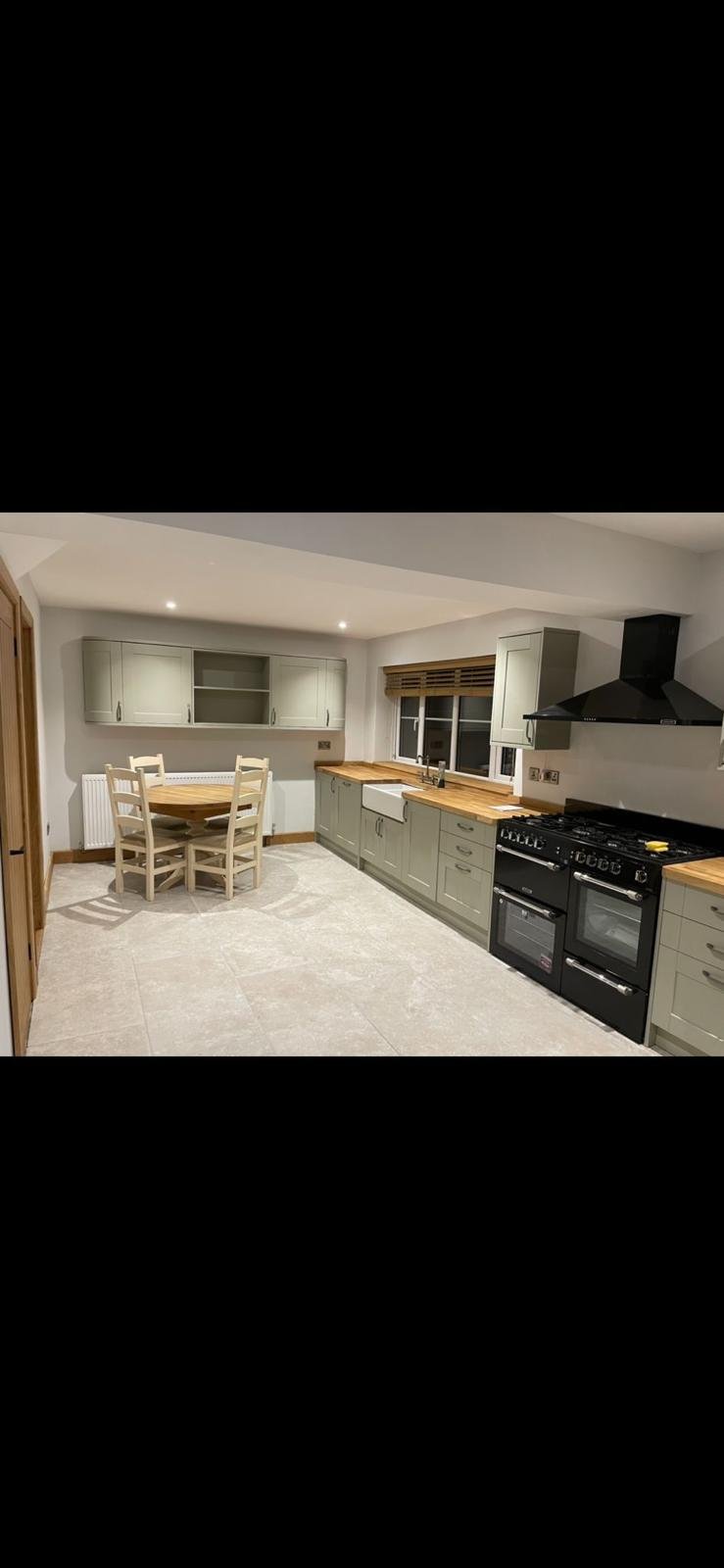 Sage green fitted kitchen