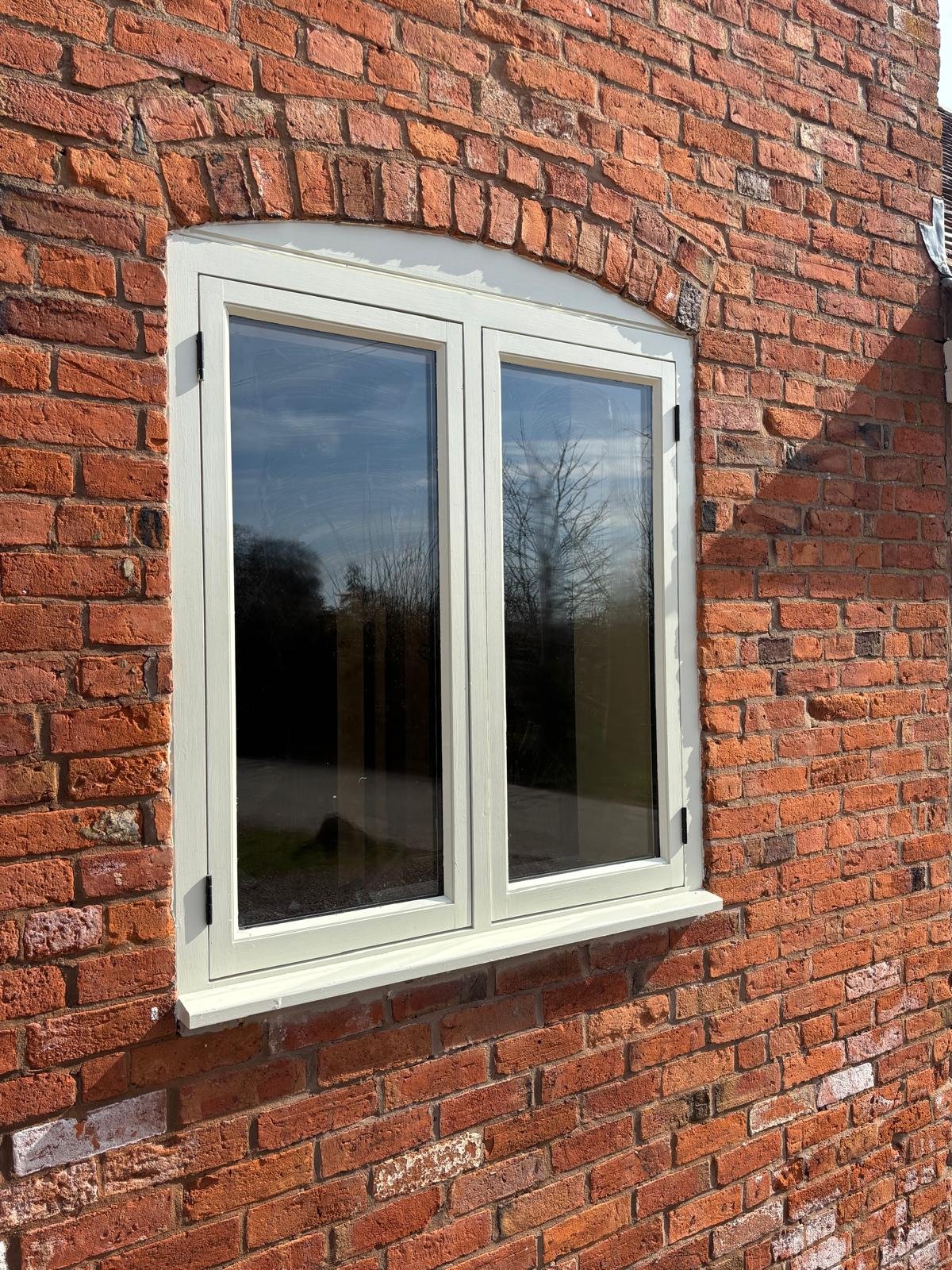 Painted arched twin casement